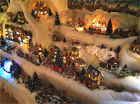 Photo of the Christmas Village display lit at night
