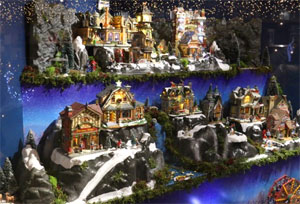 Model Christmas village display with fairy lights