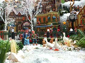 Photograph of frozen model pond and toy ducks