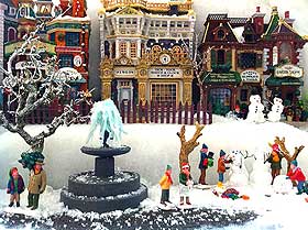 Photograph showing frozen fountain in model Christmas Village display setting