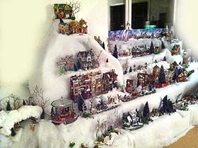 Photo of a home display, with mountains and houses arranged in rows
